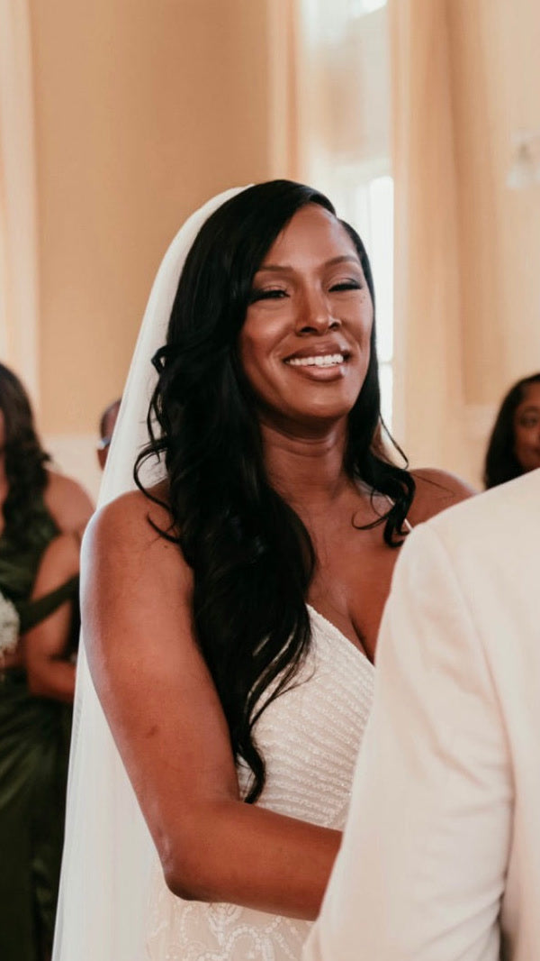 Bride wearing a Monroe Body Wave install from Fab Hair by Kaye on her wedding day