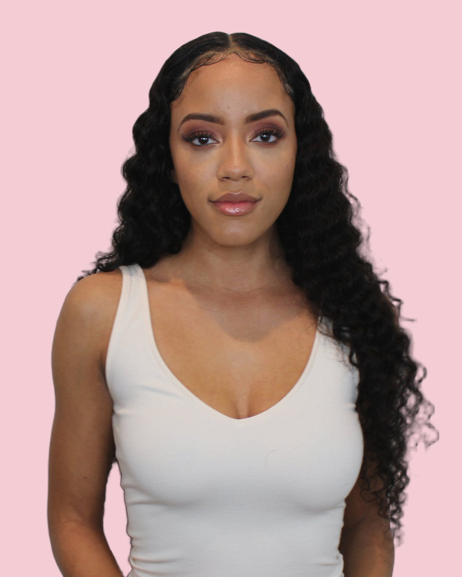 Model wearing a Tremé loose curly Signature Set, long defined curls