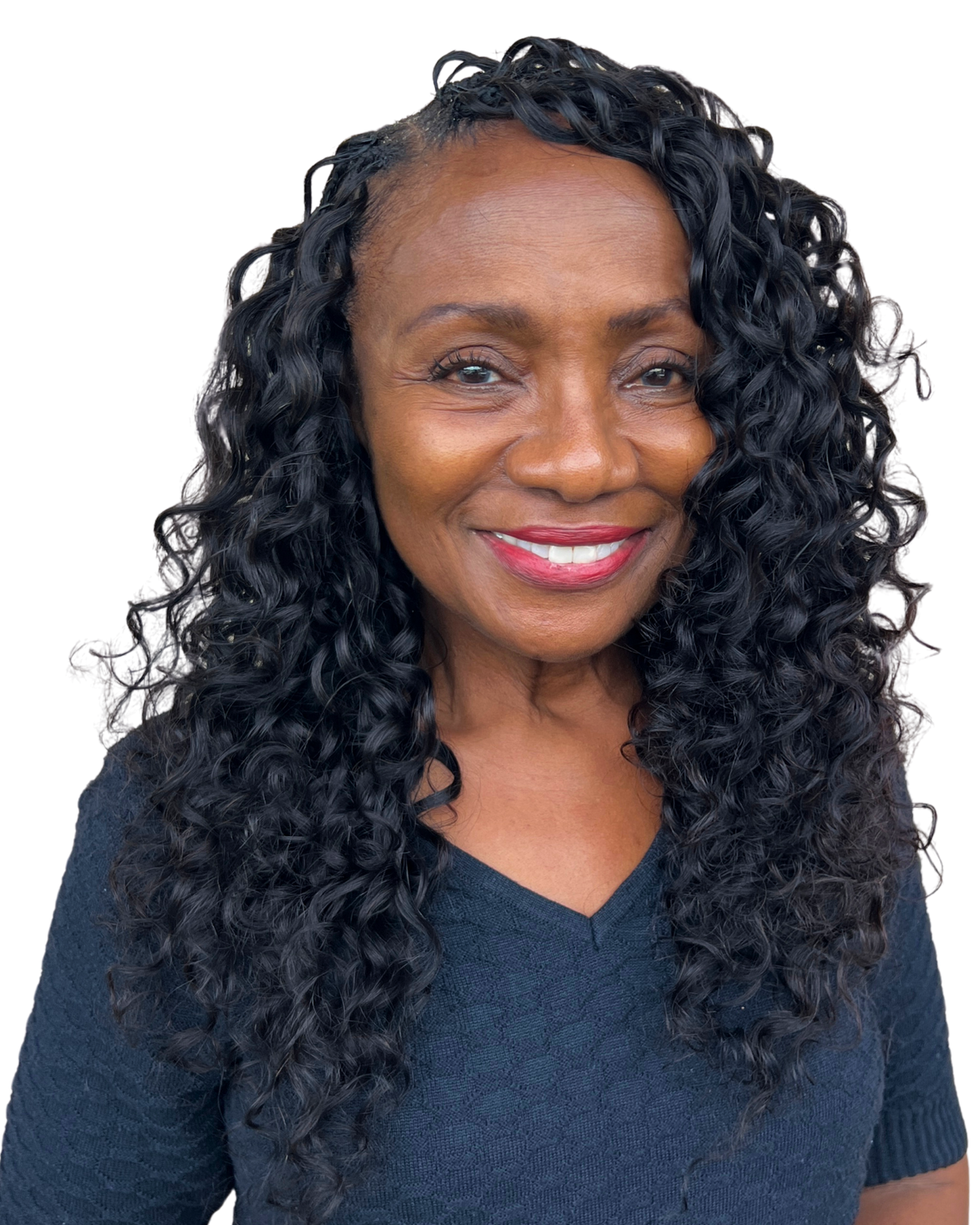 Woman wearing a full Treme loose curly feather crochet install