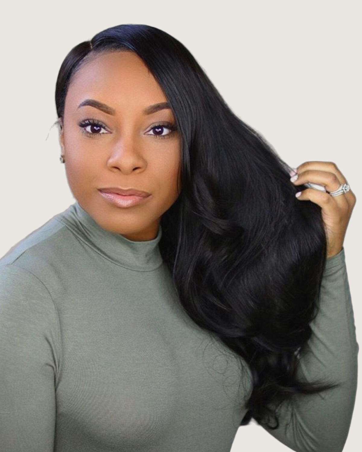 Model wearing Ansley straight virgin hair, long sleek waves swept to one side