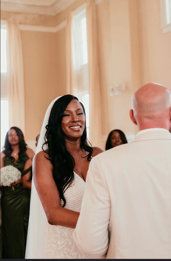 Bride wearing a Monroe body wave install on her wedding day