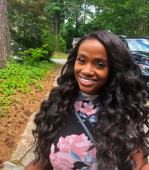 Customer outdoors wearing a Savannah loose wave install