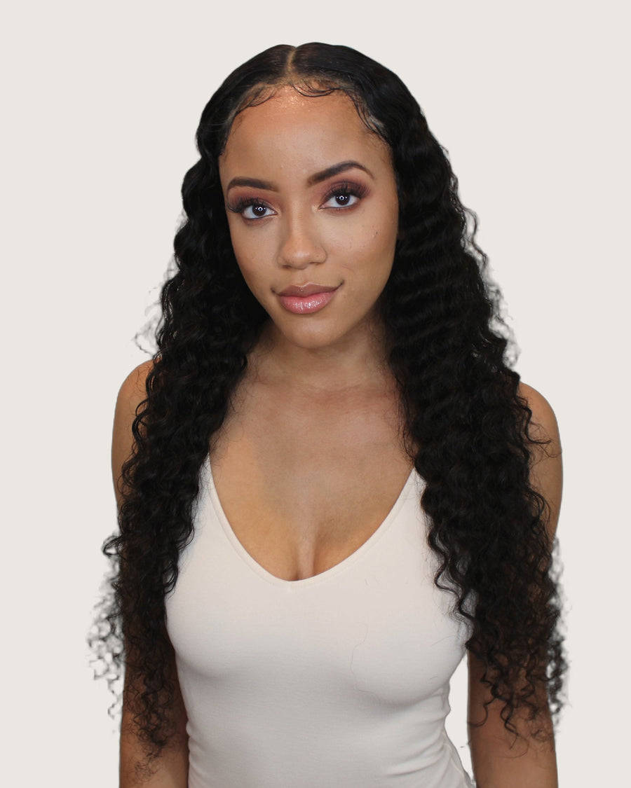 Model wearing Tremé loose curly virgin Brazilian hair, long defined curls
