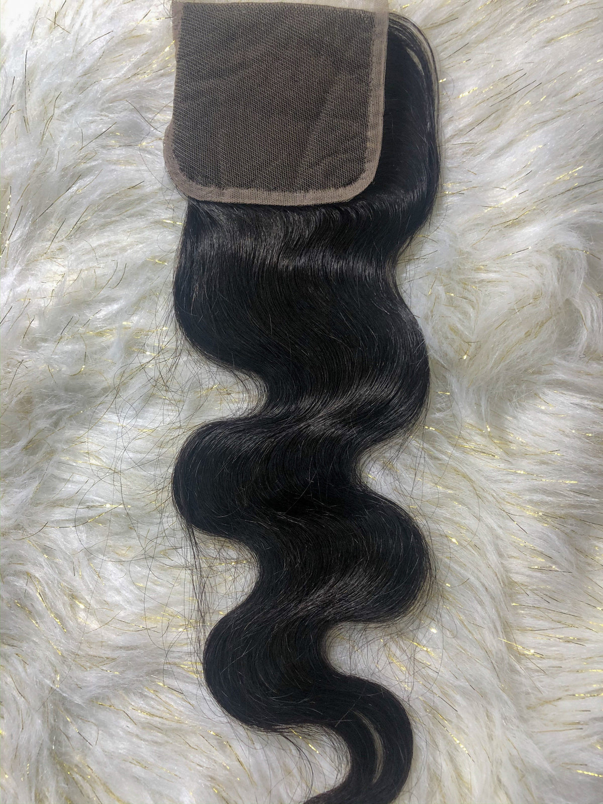 Monroe body wave HD lace closure showing the sheer lace and free part