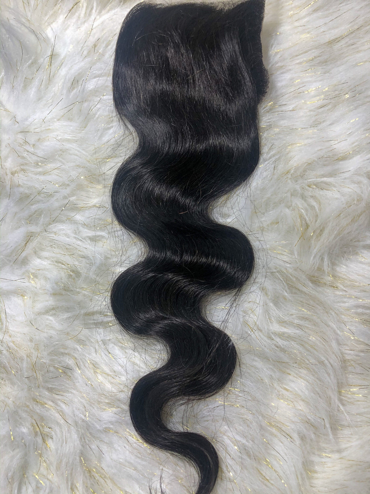Monroe body wave HD lace closure laid out to show wave pattern